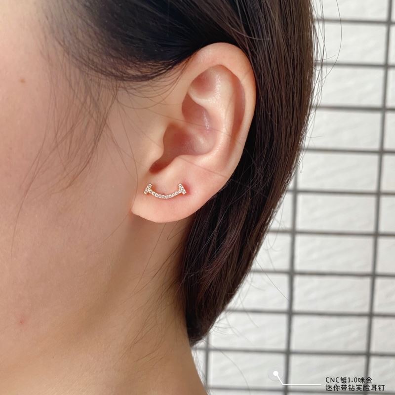 T*f*ny earrings